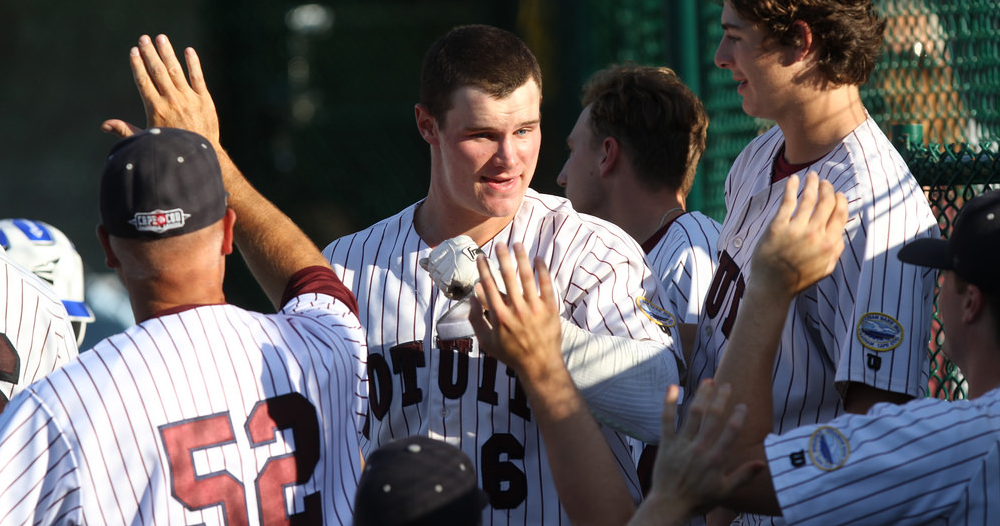 Griffin Conine celebrates with teammates earlier this year. He hit his third home run Wednesday.