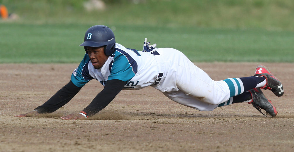Marty Costes slides into second base.
